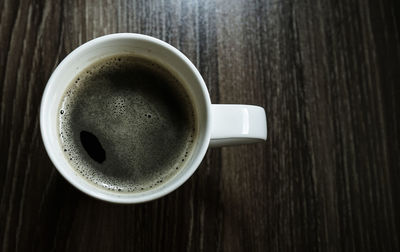 High angle view of coffee cup on table