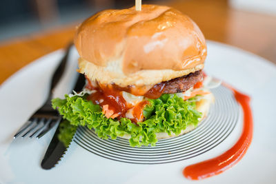 Close-up of burger in plate on table