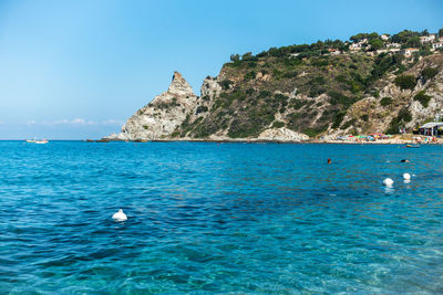 Crystal clear sea waters of grotticelle beach at capo vaticano, calabria, italy