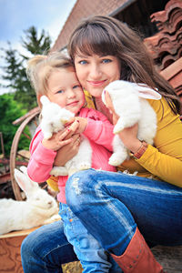 Portrait of cute girl with toy toys