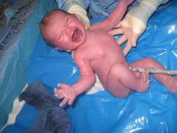 Midsection of baby boy in water