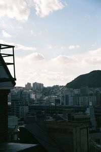 High angle view of buildings in city against sky