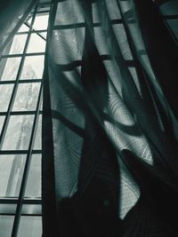 Shadow of person on window at home