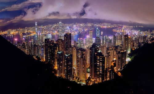 High angle view of illuminated buildings in city at night