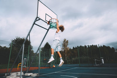 Low angle view of basketball hoop against sky