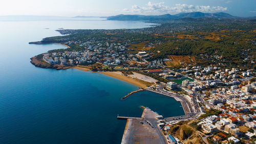 High angle view of townscape by sea