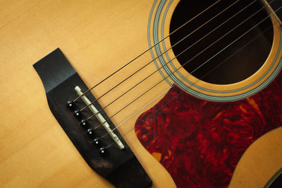 High angle view of guitar on table