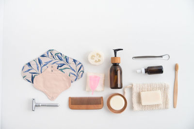 High angle view of kitchen utensils against white background
