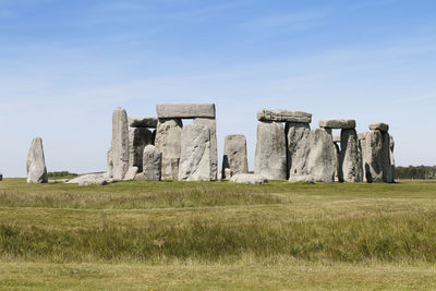 Built structure on field against sky