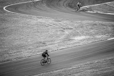 Man riding bicycle on road