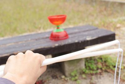 Close-up of person holding stick