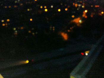 View of illuminated road at night