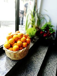 Close-up of fruits in basket on table