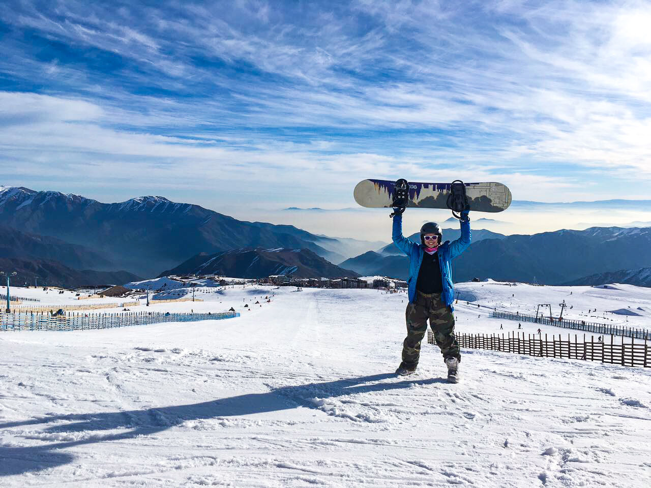 FULL LENGTH OF MAN STANDING ON SNOWCAPPED MOUNTAIN