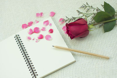 Pencil with book on table