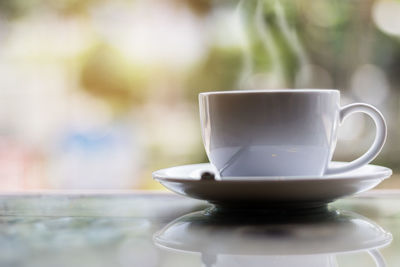 Close-up of coffee cup on table