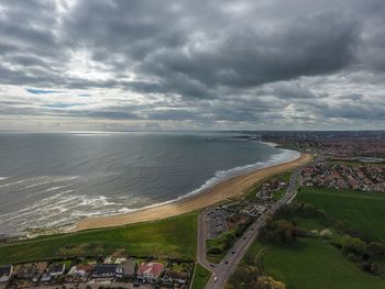 Scenic view of sea against cloudy sky