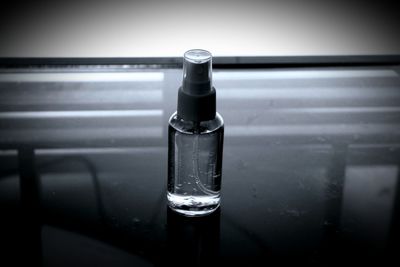 Close-up of water in glass bottle on table