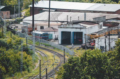 High angle view of railroad tracks amidst buildings