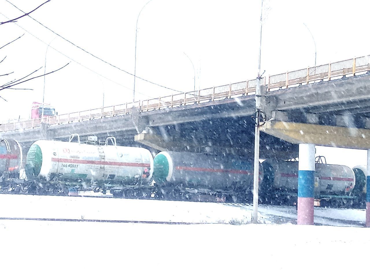 TRAIN ON SNOW COVERED BRIDGE