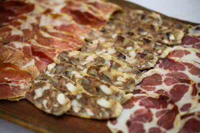 Close-up of meat slices on cutting board