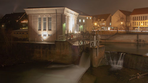 Reflection of illuminated buildings in canal at night