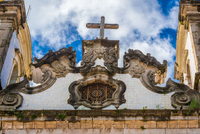 Low angle view of statue against sky