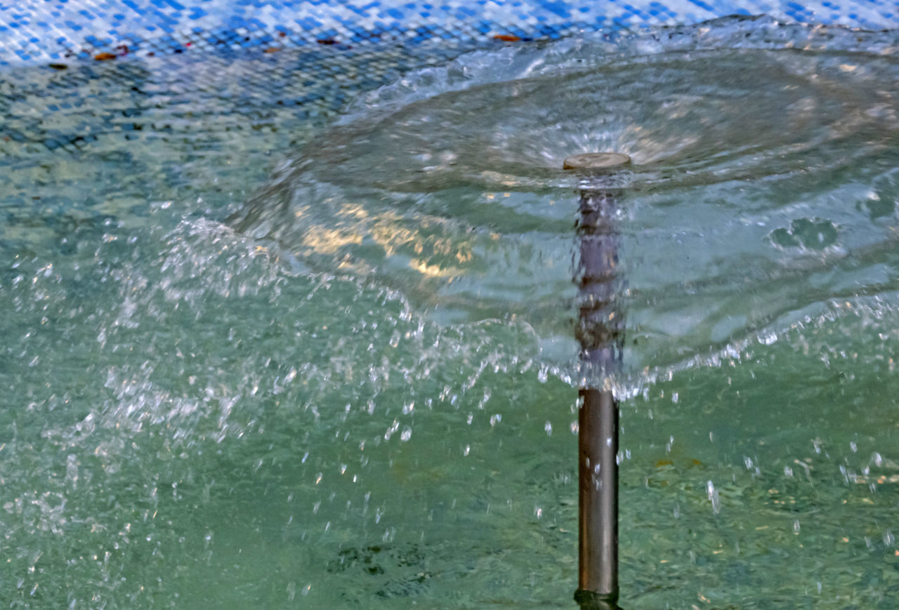 CLOSE-UP OF WATER SPLASHING ON SEA