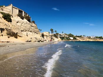 Scenic view of sea against blue sky