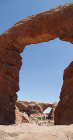 Low angle view of rock formation against clear sky