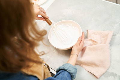 High angle view of woman preparing food