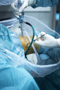 Close-up of human hand holding plastic bag