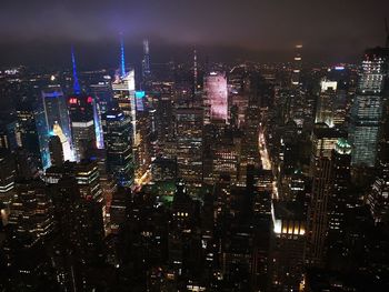 Illuminated buildings in city at night