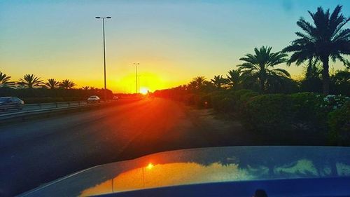 Scenic view of sunset over road