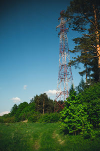 Low angle view of electricity pylon against sky