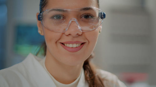 Close-up of woman wearing eyeglasses