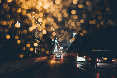 Defocused image of illuminated lights at night