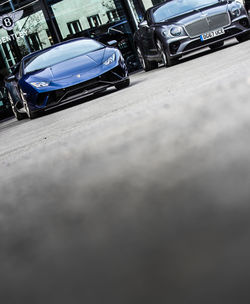 Close-up of car on road