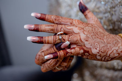 Close-up of woman hand with tattoo