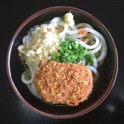 Close-up of udon noodles served on table