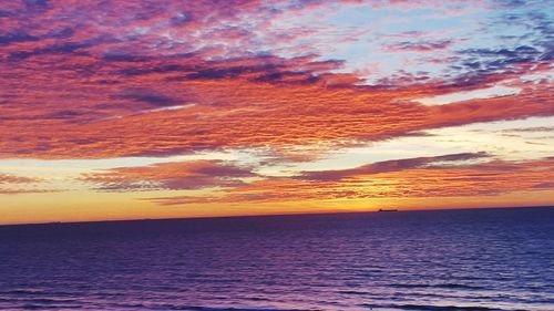 Scenic view of sea against romantic sky