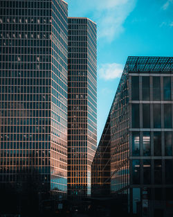 Low angle view of modern buildings against sky