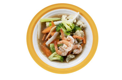 Directly above shot of food in bowl against white background