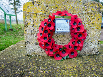 Close-up of red text on stone wall