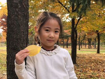 Portrait of cute boy eating outdoors