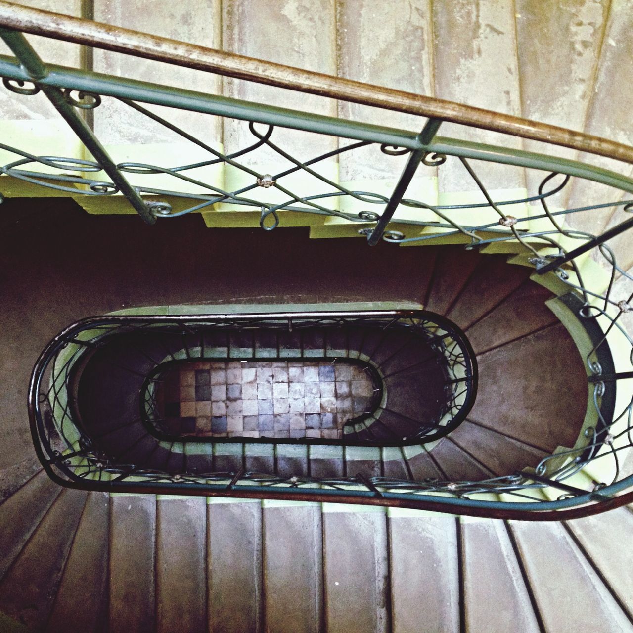 steps and staircases, staircase, steps, railing, spiral staircase, indoors, built structure, low angle view, spiral, architecture, metal, technology, pattern, circle, no people, high angle view, stairs, modern, day, arts culture and entertainment