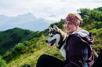 Portrait of smiling woman with dog