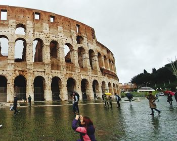 People in front of historical building