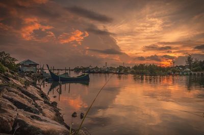 Scenic view of dramatic sky over sea during sunset