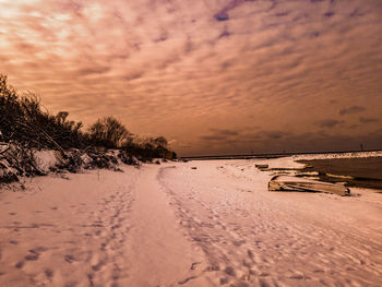 Scenic view of snow covered landscape against sky